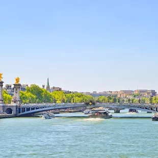 The Seine river with Alexandre III bridge and Eiffel Tower in the background