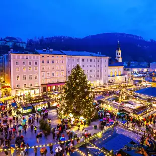 Aerial view of Salzburg's Christmas Market illuminated at night in Austria
