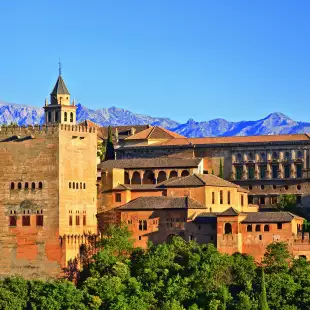 View on Alhambra at sunset with distant mountains in the background, Spain
