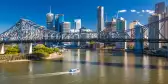 Ferry boat under Story Bridge with skyline of Brisbane, Queensland, Australia