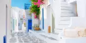 White-coloured buildings and bright flowers on the island of Mykonos, Greece