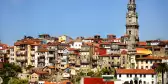 Clerigos church tower and Ribeira old town skyline in Porto, Portugal