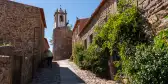 Narrow cobbled street and old stone houses in Castelo Rodrigo, Portugal