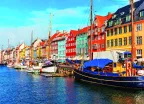 Nyhavn pier with colourful buildings, ships, yachts and other boats in the Old Town of Copenhagen, Denmark.