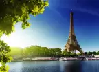 The River Seine and the Eiffel Tower during sunrise in Paris, France