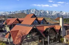 Outside of the Copthorne Hotel Resort, with red roofs and snowy mountains