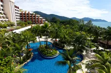 Aerial view of Parkroyal Resort with outdoor pool and palm trees in Penang, Malaysia