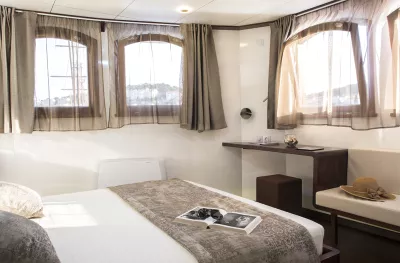 Double bed cabin room aboard the MV Corona