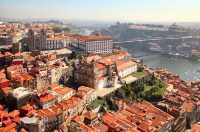 An aerial shot of the Porto Cathedrals next to the Douro River, Portugal