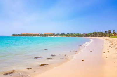 Sandy Passikudah beach and blue seas under a clear sky, Sri Lanka