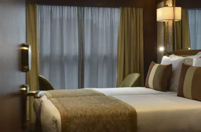 Double bed suite with evening lighting on the MS Douro Splendour