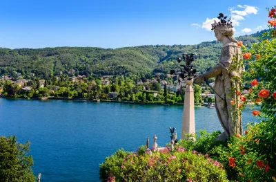 Isola Bella island and Lake Maggiore with statue and garden in Italy