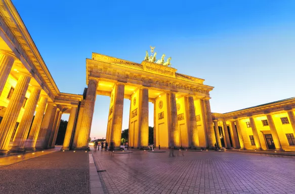 Brandenburg Gate illuminated at night in Berlin, Germany.