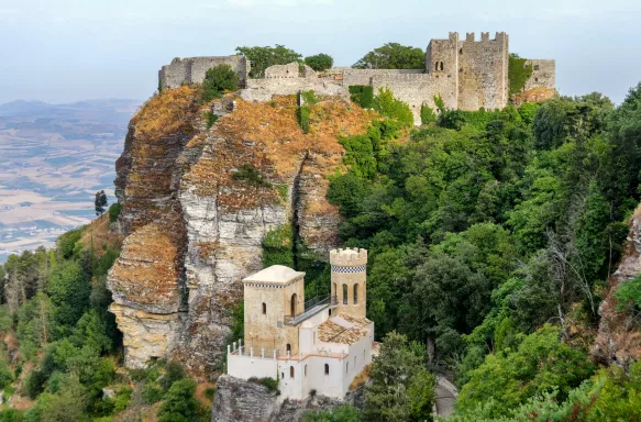 Historic Fort and lush vegetation on rocky clifftop in Erice, Sicily, Italy