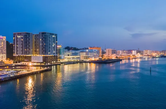 Aerial view of Kota Kinabalu city in the evening along the water, Malaysia