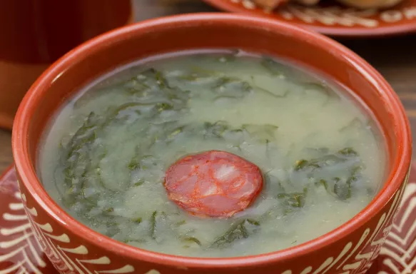 Traditional Portuguese soup, Caldo Verde, with bread and chorizo