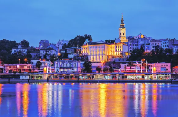 Belgrade at night with it's colourful town lights reflecting in the river Sava 
