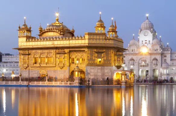 View of the Golden Temple and reflections in water in Amritsar, India