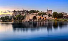 Avignon Bridge with Popes Palace and Rhone river in Pont Saint-Benezet, France