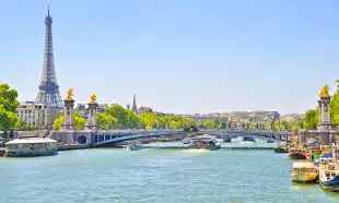 The Seine river with Alexandre III bridge and Eiffel Tower in the background