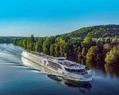 Image of the jane austen sailing down the calm waters of the river rhine against a blue sky