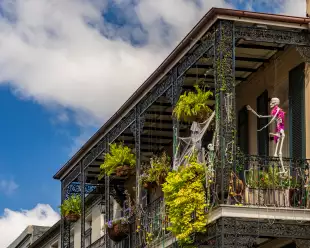 	Halloween decorations on traditional New Orleans building in the French Quarter with wrought iron balconies