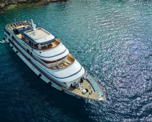 Yacht ship anchored in the crystal blue waters of a croatian bay