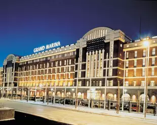 Exterior of Scandic Grand Marina under a clear evening sky