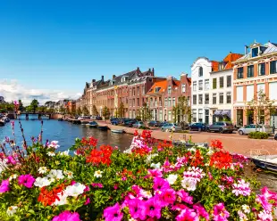 Scenic summer view of the Old Town architecture and Spaarne canal embankment in Haarlem