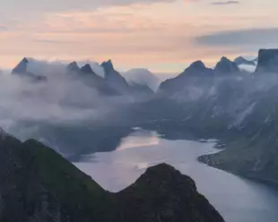 Scenic view of Fjord with mist in Norway during Summer
