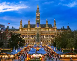 Traditional Christmas market at Vienna Town Hall at night in front of town hall