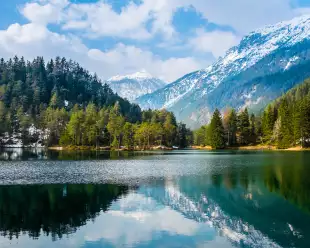 Fantastic views of the tranquil lake with amazing reflection. Mountains & glacier in the background. Peaceful & picturesque landscape. Location: Austria, Europe.