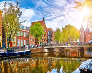 Netherlands houses overlooking the river Amstel canal in Amsterdam