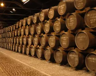 Stacks of port wine barrels in cellar at Graham's Port Lodge in Portugal