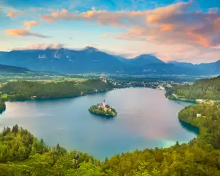 Julian Alps and Lake Bled with St. Marys Church on small island in Slovenia, Europe