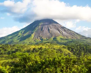 View of Arenal Volcano surrounded by rainforest in Costa Rica