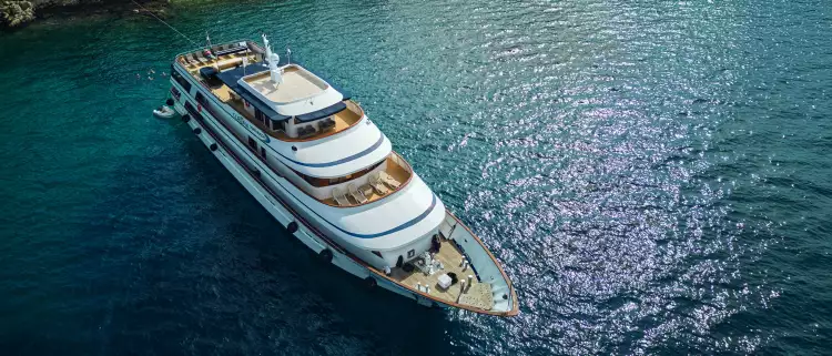 Yacht ship anchored in the crystal blue waters of a croatian bay