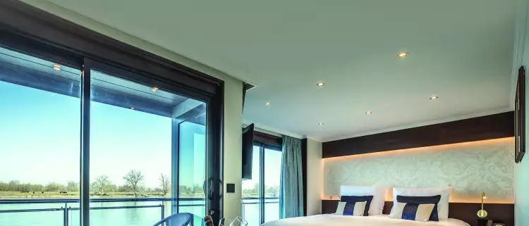 Interior of a cabin bedroom aboard the George Eliot cruise ship