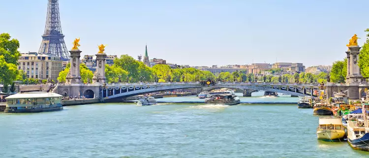The Seine river with Alexandre III bridge and Eiffel Tower in the background
