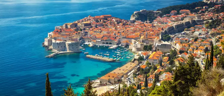 Aerial view of Dubrovnik city with old town houses and beautiful sea waters
