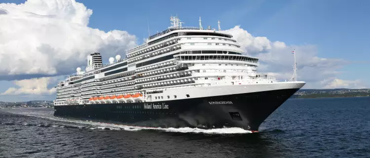 Exterior of the MS Koningsdam in motion along the sea, a Holland America Line ship