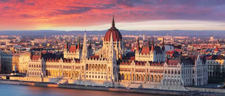 Aerial view of parliament building at dramatic sunrise in Budapest, Hungary