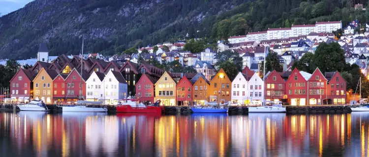Colourful city of Bergen illuminated at night in Norway