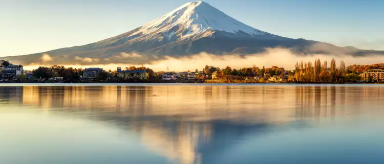 Mount Fuji and its reflection in lake on a bright day in Japan