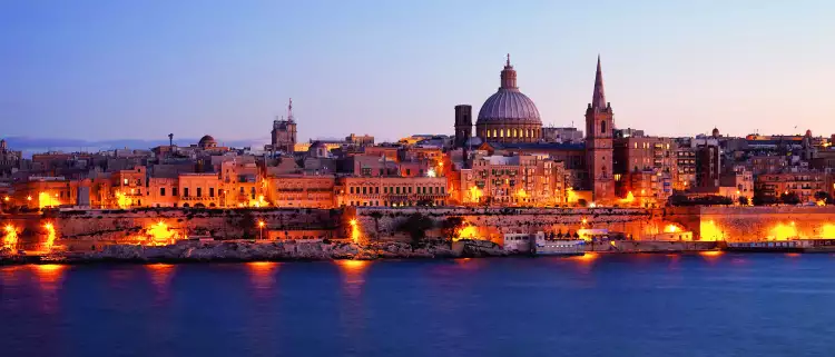 View of Valletta illuminated at night in Malta