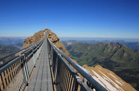 Suspension bridge connecting two mountain peaks in the Alps, Switzerland.