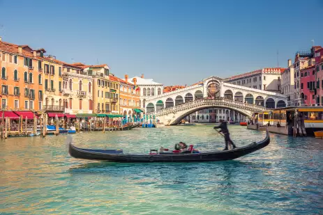 Rialto Bridge and Grand Canal with boat in Venice, Italy